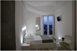Posteľ alebo postele v izbe v ubytovaní Quintessenza - Charme Rooms