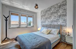 Postel nebo postele na pokoji v ubytování Lola app in city center, 4+1 pax + 35 fotografií
