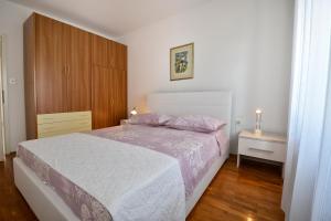 Posteľ alebo postele v izbe v ubytovaní Apartments Palmic