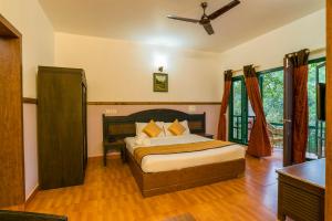 Katil atau katil-katil dalam bilik di Upavan Resort