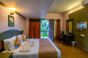 Katil atau katil-katil dalam bilik di Upavan Resort