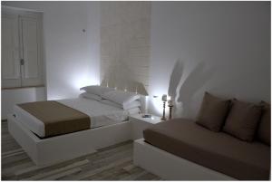 Posteľ alebo postele v izbe v ubytovaní Quintessenza - Charme Rooms