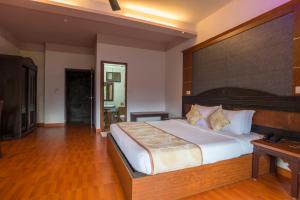 Katil atau katil-katil dalam bilik di Upavan Resort