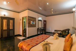 Katil atau katil-katil dalam bilik di Upavan Resort