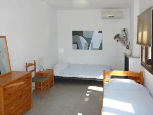 Katil atau katil-katil dalam bilik di Villa Mola Kalyva