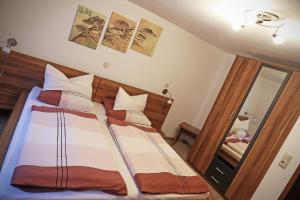 Postel nebo postele na pokoji v ubytování Ferienhaus Mainschleife