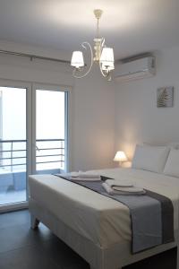 Tempat tidur dalam kamar di Blue4Aqua Apartments