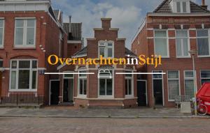 a brick building with the words overlanditutionitutionrift on it at Skipper 4 - 3 bedroom authentic detached house in City Center in Groningen
