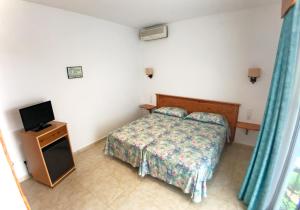 Postel nebo postele na pokoji v ubytování Hotel Port-Bo