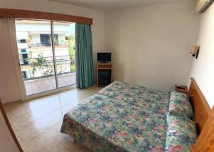 Postel nebo postele na pokoji v ubytování Hotel Port-Bo