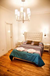 a bedroom with a large bed in a room at Galeon Mar del Plata Hotel in Mar del Plata