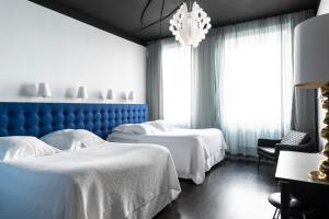Voodi või voodid majutusasutuse Hotel Flora toas