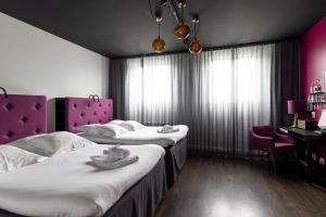 Voodi või voodid majutusasutuse Hotel Flora toas