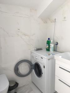 a bathroom with a washing machine and a sink at Melodia del Mare in Kotor +84 photos