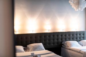 Voodi või voodid majutusasutuse Hotel Flora toas