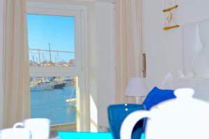 Posteľ alebo postele v izbe v ubytovaní Rivamare Loft SEASIDE by Picasa Sicilia - Sea & Ortigia view