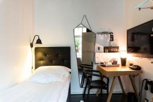 Voodi või voodid majutusasutuse Hotel Flora toas
