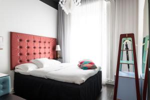 Voodi või voodid majutusasutuse Hotel Flora toas