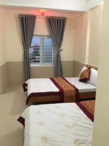 Postel nebo postele na pokoji v ubytování Phương Phương 2 Hotel + 25 fotografií