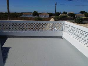 a white fence on a balcony with a view at La Aceitera de Trafalgar in Zahora