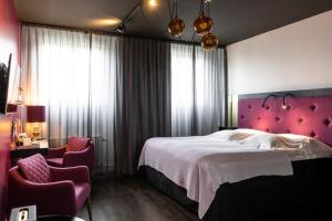 Voodi või voodid majutusasutuse Hotel Flora toas