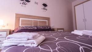 A bed or beds in a room at Apartamento Nuevo con Encanto
