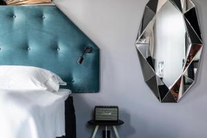 Voodi või voodid majutusasutuse Hotel Flora toas