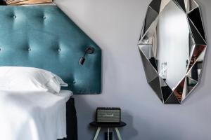 a hotel room with a bed and a television at Hotel Flora in Gothenburg