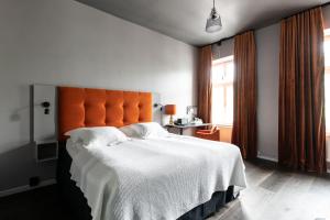 Voodi või voodid majutusasutuse Hotel Flora toas