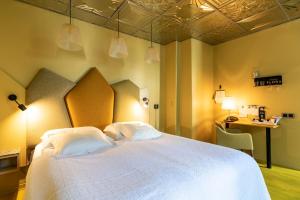 Postel nebo postele na pokoji v ubytování Hotel Flora