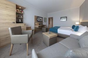 Postel nebo postele na pokoji v ubytování Hotel Logotel