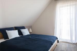 Łóżko lub łóżka w pokoju w obiekcie Apartamenty Port Ustka