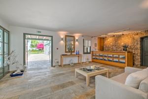 a living room with a couch and a table at Dioni Hotel in Skiros