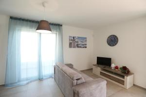TV a/nebo společenská místnost v ubytování Casa cielo&mare