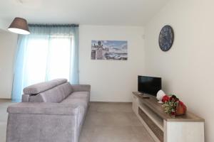 TV a/nebo společenská místnost v ubytování Casa cielo&mare