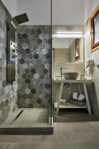 a bathroom with a shower and a sink at Mirabeli Apartments & Suites in Pollonia +37 photos