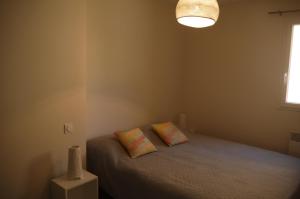 Postel nebo postele na pokoji v ubytování Les Oliviers + 14 fotografií