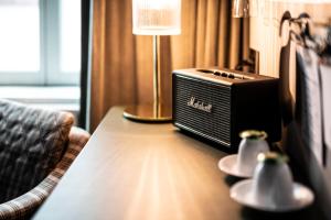 Televiisor ja/või meelelahutuskeskus majutusasutuses Hotel Flora
