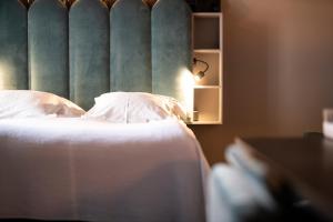 Voodi või voodid majutusasutuse Hotel Flora toas