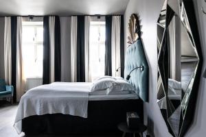 Voodi või voodid majutusasutuse Hotel Flora toas