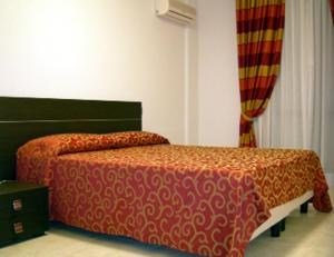 A bed or beds in a room at Residence Montegrappa