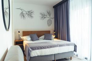 Postel nebo postele na pokoji v ubytování MORENIA All Inclusive Hotel