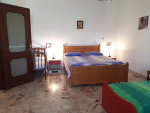 A bed or beds in a room at Affittacamere delle rose