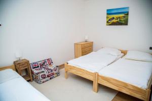 Posteľ alebo postele v izbe v ubytovaní Penzion Rejžák