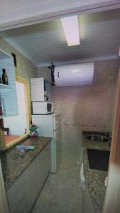 Kuchyň nebo kuchyňský kout v ubytování Apartamento Neptuno + 5 fotografií