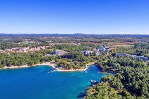 an aerial view of a resort and a body of water at Ferienwohnungen Velijoze in Poreč