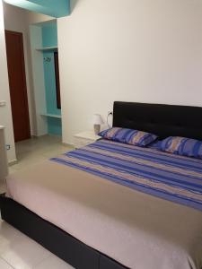 Posteľ alebo postele v izbe v ubytovaní B&B Torre Nave