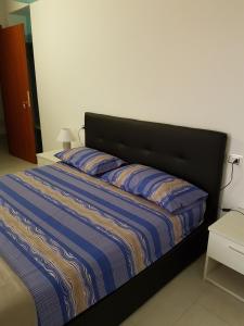 Posteľ alebo postele v izbe v ubytovaní B&B Torre Nave