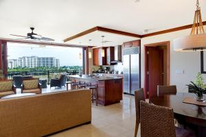 a kitchen and dining room with a view of the city at Sixth Floor Villa with Sunrise View - Beach Tower at Ko Olina Beach Villas Resort in Kapolei