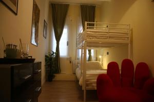 A bed or beds in a room at Mila Guest House